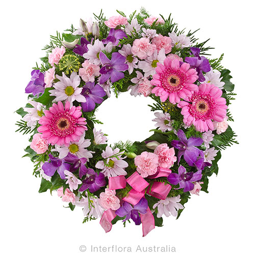 A heartfelt sympathy wreath in pinks